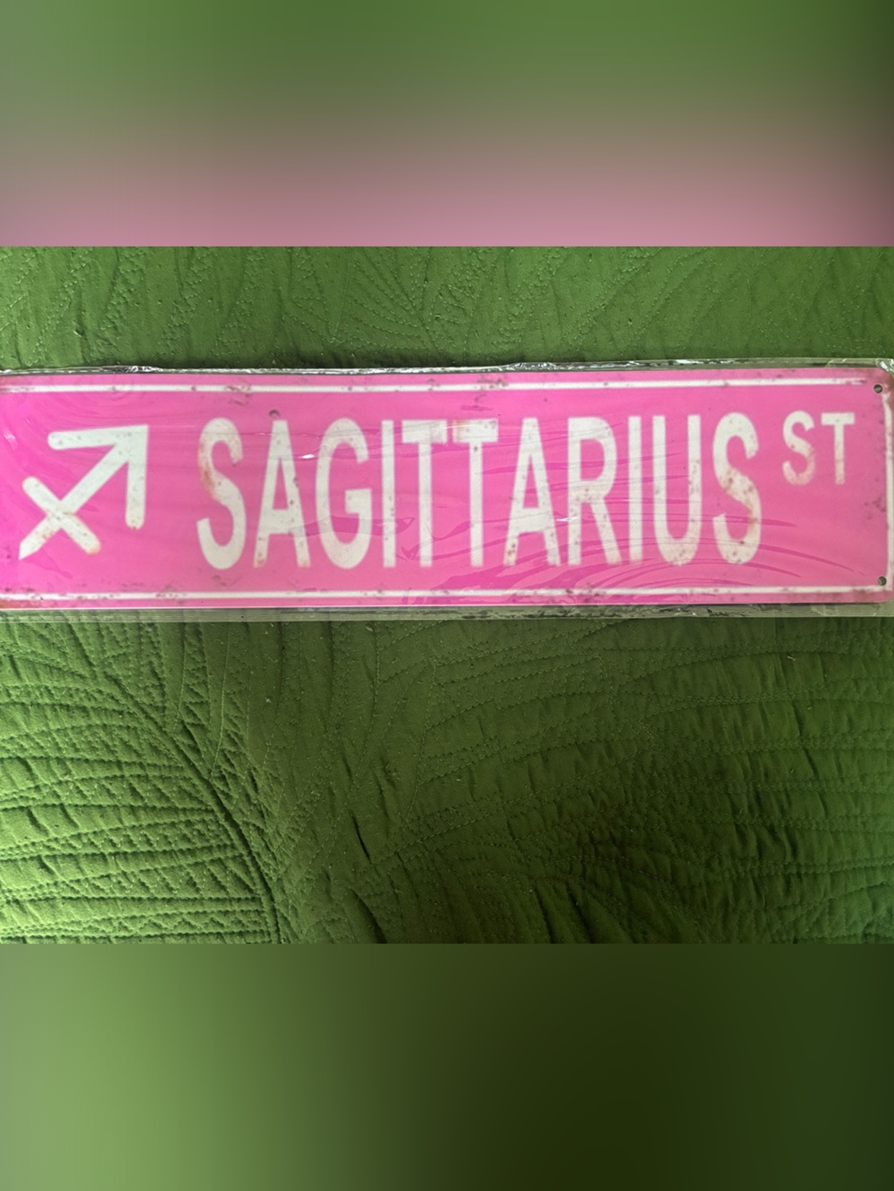 Pink Sagittarius Street Sign